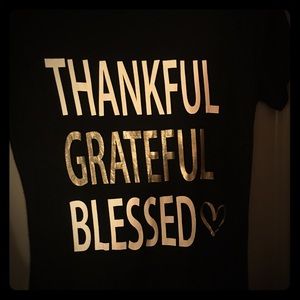 Large shirts with gold lettering.